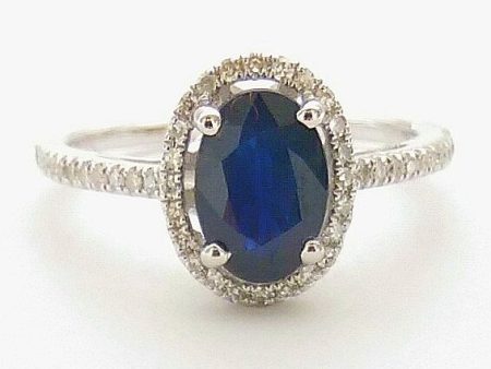 5X7MM Oval Blue Sapphire and Diamond Halo Ring in 14KT White Gold Fashion